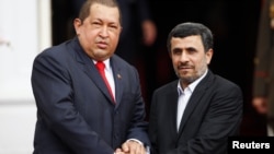 Hugo Chavez (left) with Iranian President Ahmadinejad in Caracas in January, 2012.