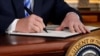 U.S. -- U.S. President Donald Trump signs a proclamation declaring his intention to withdraw from the JCPOA Iran nuclear agreement in the Diplomatic Room at the White House in Washington, U.S. May 8, 2018. 