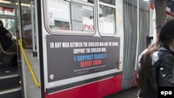 A city bus with a pro-Israel ad from the American Freedom Defense Initiative on it passes through downtown San Francisco.