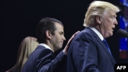 Donald Trump, Jr., (left) and his father, U.S. Donald Trump (file photo)