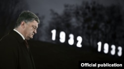 Ukrainian President Petro Poroshenko pays his respects to victims during events dedicated to the Holodomor in Kyiv on November 26.