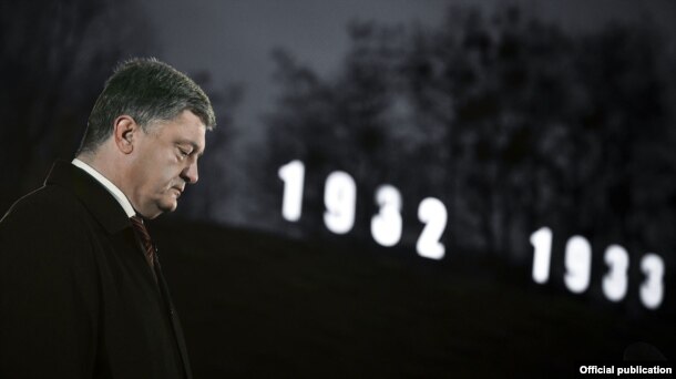 Ukrainian President Petro Poroshenko pays his respects to victims during events dedicated to the Holodomor in Kyiv on November 26.