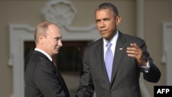 Russian President Vladimir Putin (left) with U.S. counterpart Barack Obama at the start of the G20 summit in St. Petersburg last year. 