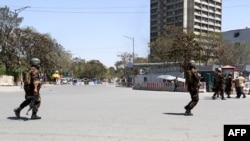 Afghanistan -- security personnel stand guard near the Communication Ministry as an attack between Afghan forces and attackers in central Kabul, 20Apr2019