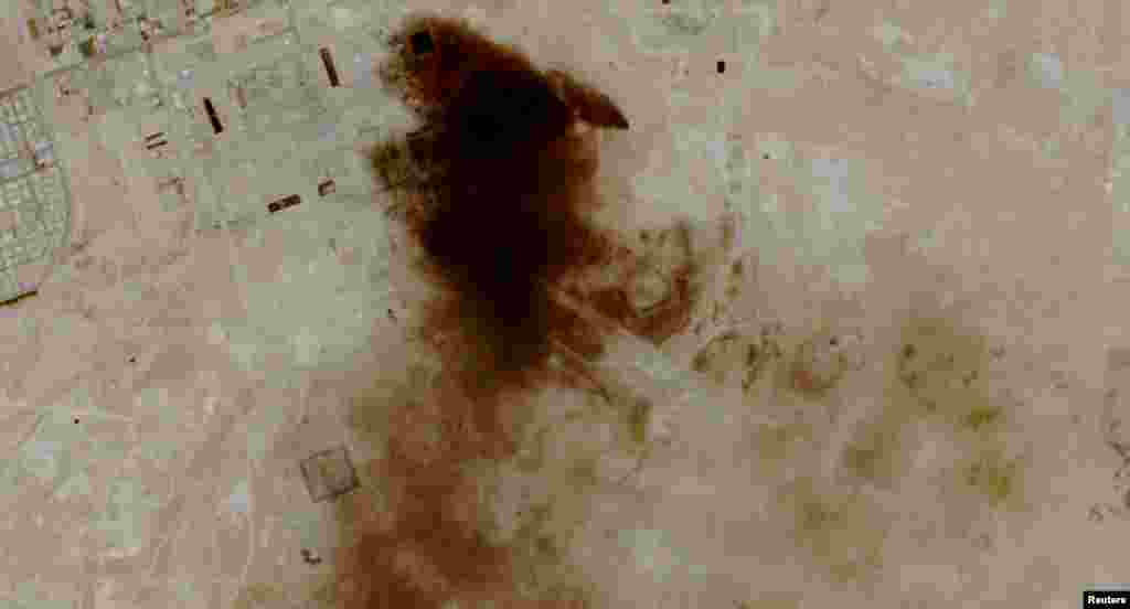 A satellite image of smoke billowing from the Aramco oil facility in Abqaiq, Saudi Arabia, on April 8. The reported attack highlighted the fragility of the truce and came just hours after the announcement of the temporary cease-fire deal between the United States and Iran.