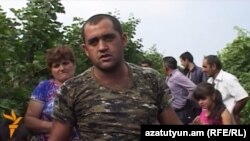 Armenia - A farmer in Paravakar village talks to RFE/RL, 1Oct2015.