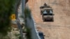 Израильские военные автомобили на границе с Ливаном