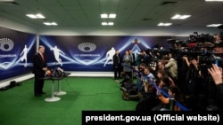 Ukrainian President Petro Poroshenko speaks to journalists at the Olimpiyskiy Stadium in Kyiv on April 10.