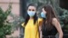 Armenia -- Young women wear face masks in Yerevan, August 11, 2020.