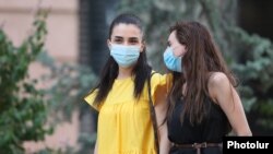 Armenia -- Young women wear face masks in Yerevan, August 11, 2020.