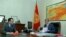 Temir Jumakadyrov (left), a Kyrgyz deputy prime minister killed in a car accident on October 7, meeting with Kyrgyz President Almazbek Atambaev in 2015.