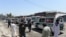 Ambulances transport the bodies of Afghan Sikhs killed in a suicide attack in Jalalabad on July 2.