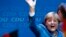 German Chancellor Angela Merkel waves to supporters as she celebrates after the first exit polls at party headquarters in Berlin on September 22.