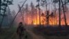 A volunteer heads off to fight a forest fire in Russia&#39;s Yakutia region on July 17.&nbsp;