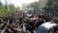 Mourners pay their respects to Morteza Pashaei outside the Tehran hospital where he died on November 14. The last time Iranians took to the streets spontaneously in such large numbers was following the disputed 2009 presidential election.