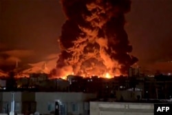 This video grab taken from UGC images posted on social media on March 7 and 8 shows fire erupting at an oil depot in Iran's capital, Tehran.