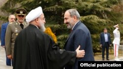 Iran - Iranian President Hassan Rouhani greets Armenian Prime Minister Nikol Pashinian in Tehran, February 27, 2019.