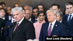 Franklin Graham (left), shown speaking during President Donald Trump's January 2025 inauguration, is the son of Billy Graham, who gained worldwide renown for his preaching.