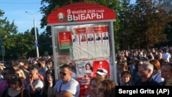 BELARUS - Supporters of Sviatlana Tsikhanouskaya, candidate for the presidential elections, attend a rally in Minsk, Belarus, Thursday, Aug. 6, 2020. The presidential election in Belarus is scheduled for Aug. 9, 2020.