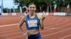 Sprinter Krystsina Tsimanouskaya flashes the victory sign during a track competition at a stadium in Szczecin, Poland, on August 15. 