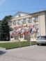 Moldova, People walk down the street with the Gagauzia People's Assembly building in the background, Comrat, July 29, 2026
