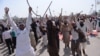 Pakistani supporters of convicted murderer Mumtaz Qadri shout slogans during an anti-government protest in Islamabad in March 2016.