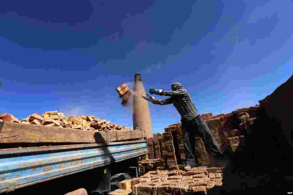 An Afghan man works at a brick kiln in Herat. (epa/Jalil Rezayee)