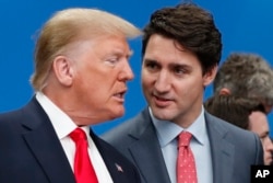 Președintele SUA, Donald Trump, și premierul canadian, Justin Trudeau, la un summit NATO din Anglia, în 2019.