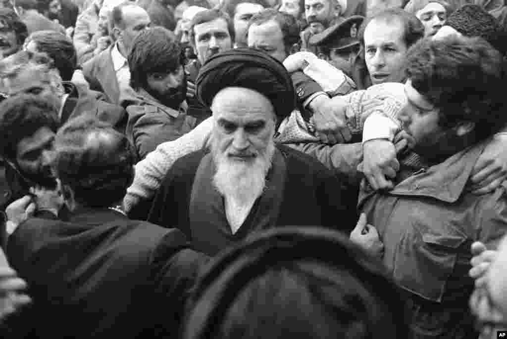 Khomeini is thronged by his supporters at Tehran&#39;s airport. &nbsp;