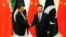 Chinese President Xi Jinping (right) shakes hands with Pakistani Prime Minister Imran Khan in Beijing on November 2.