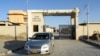 A car leaves the district headquarter hospital in Panjgur town of Balochistan Province on January 17, where victims of the Iranian air strike were taken.