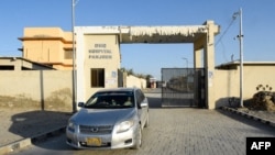 A car leaves the district headquarter hospital in Panjgur town of Balochistan Province on January 17, where victims of the Iranian air strike were taken.