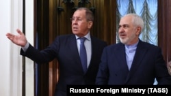 Russian Foreign Minister Sergei Lavrov (left) meets with his Iranian counterpart Mohammad Javad Zarif in Moscow on January 26.