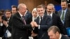 Turkish President Recep Tayyip Erdogan (left) shakes hands with French President Emmanuel Macron at a plenary session during the European Political Community (EPC) summit in Budapest in November 2024.
