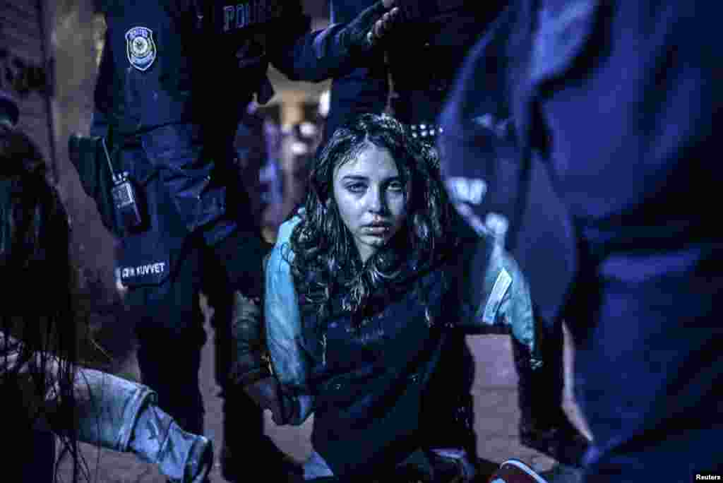 Bulent Kilic, a Turkish photographer for Agence France-Presse, won First Prize in the Spot News Category, Singles, with this picture of a young girl after she was wounded during clashes between riot police and protesters following the funeral of Berkin Elvan, an 15-year-old boy who died from injuries suffered during antigovernment protests in Istanbul.