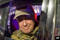 Yevgeny Prigozhin looks out from a military vehicle on a street in Rostov-on-Don on June 24.