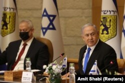 Primul ministru israelian Benjamin Netanyahu și ministrul apărării Benny Gantz participă la o ședință specială a cabinetului cu ocazia Zilei Ierusalimului, la Ierusalim, 9 mai 2021.