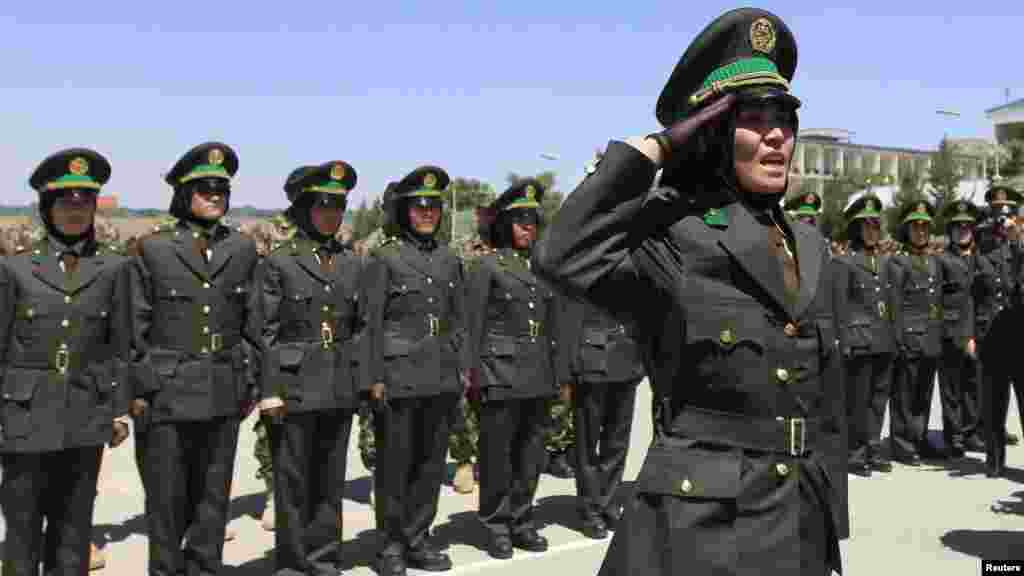 An Afghan female officer salutes during a graduation ceremony at the Kabul Military Training Center. (Reuters/Mohammad Ismail)