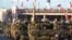 Солдати латвійської армії на бойових машинах розвідки їдуть вулицями Риги