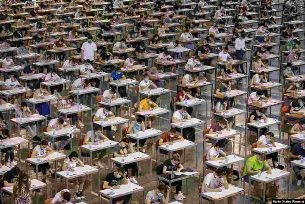 Students take a university entrance exam in Belgrade on June 30 amid a coronavirus outbreak in the Serbian capital. (Reuters/Marko Djurica)