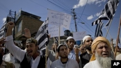 Supporters of the Jamiat Ulema-e-Islam chant slogans during an anti-U.S. rally in Abbottabad in May 2011