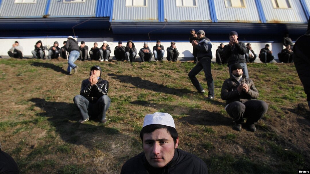 Muslim migrant workers attend special prayers on the first day of the Muslim holiday Eid al-Adha in Moscow in November 2011.