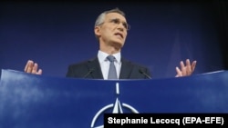 NATO Secretary-General Jens Stoltenberg speaks during a news conference during a North Atlantic Council defense ministers meeting in Brussels on November 9.