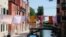Laundry hangs on clothes lines strung above street between apartment buildings Italy's lockdown measures continue to prevent the spread of coronavirus disease (COVID-19) in Venice