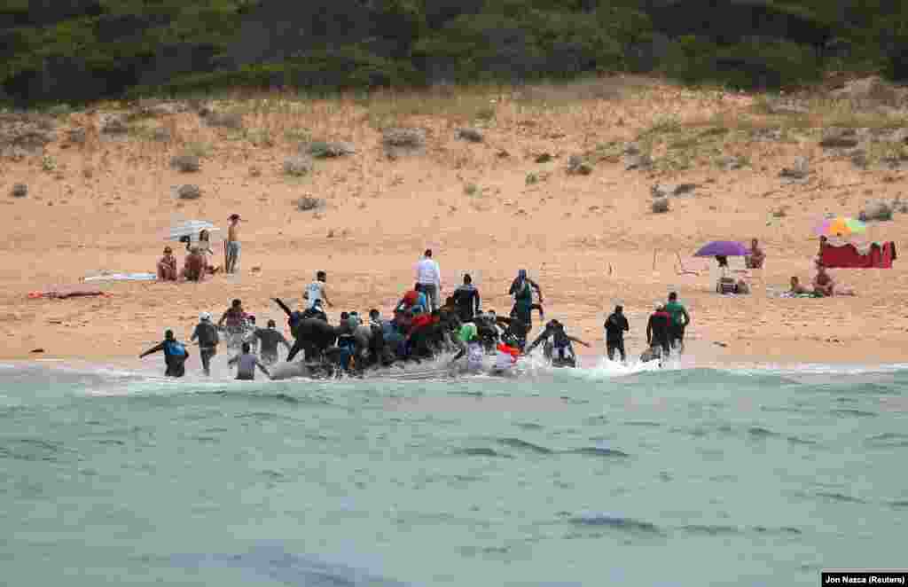 Moroccan migrants disembark from a dinghy in Tarifa, southern Spain, after crossing the Strait of Gibraltar from the coast of Morocco. (Reuters/Jon Nazca)