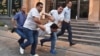 Armenia - Plainclothes police officers arrest a protester on Marshal Bagramian Avenue, Yerevan, 23Jun2015.