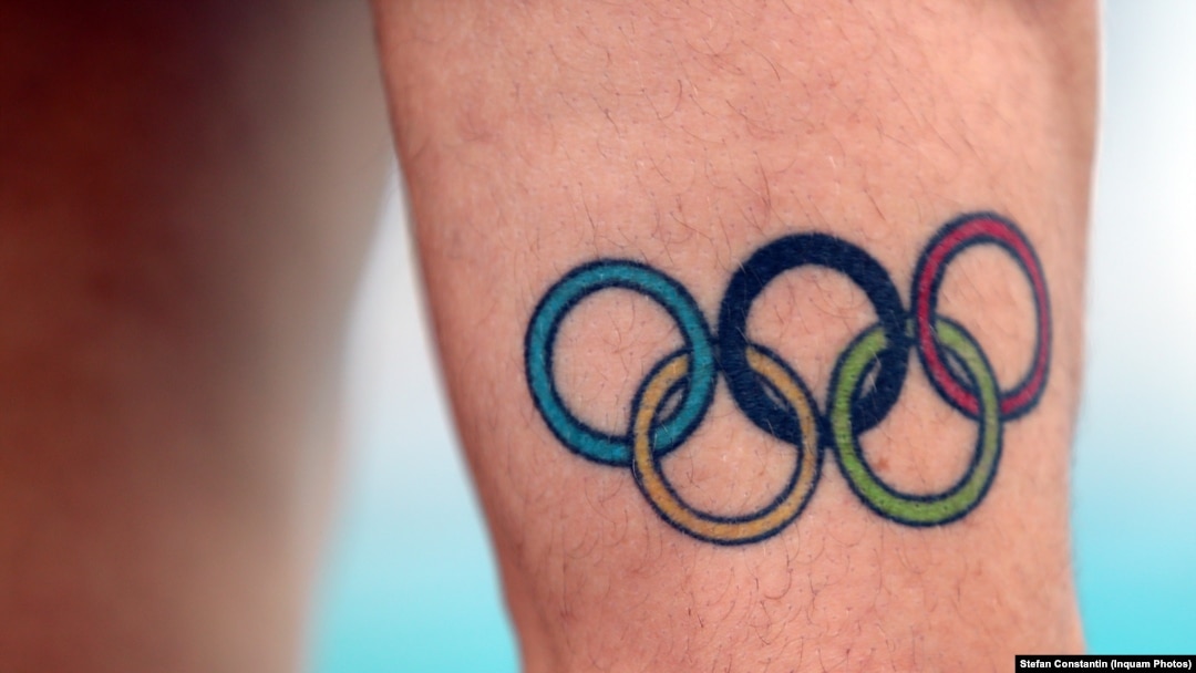 Echipa olimpică a României din anul acesta (100 de sportivi) este ceva mai mare decât lotul din 2016 de la Rio (96 de sportivi) și puțin mai mic față de numărul de sportivi trimiși la Londra, în 2012 (104 sportivi). În imagine, tatuajul lui Robert Glință, purtător de drapel al României.