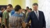 Ukrainian President Petro Poroshenko welcomes servicemen released from captivity in the Donetsk region during a meeting in Kyiv on August 15.