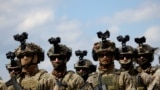 <p>Soldiers from the European Union Force Bosnia and Herzegovina (EUFOR) stand guard in Camp Butmir, a EUFOR base near Sarajevo. 