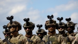 <p>Soldiers from the European Union Force Bosnia and Herzegovina (EUFOR) stand guard in Camp Butmir, a EUFOR base near Sarajevo. 